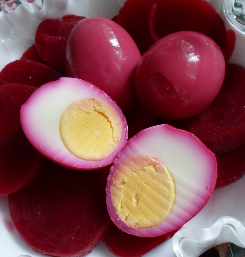 A bowl of vibrant red and pink pickled beet eggs with a fork and knife on the side

Learn how to make your own pickled red beet eggs with this comprehensive guide. The vibrant color and tangy flavor of pickled beets make these eggs a fun addition to any meal or snack. From boiling the eggs to creating the right brine, follow these simple steps to make perfect pickled red beet eggs every time. The best part? You only need a few ingredients and a bit of patience to make these delicious and nutritious eggs. Enjoy them in your salad, as a sandwich topper, or as a healthy snack straight from the jar.