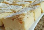 Indulge in Vanilla Custard Cream Squares: A heavenly dessert featuring layers of crispy puff pastry and luscious vanilla custard, topped with whipped cream. A delightful treat for your taste buds.