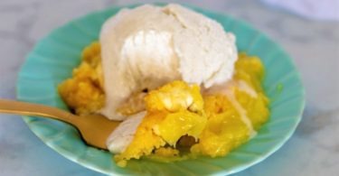 Serving of Lemon Cream Cheese Dump Cake: "A slice of Lemon Cream Cheese Dump Cake served on a plate, showcasing the tangy lemon filling and creamy texture."