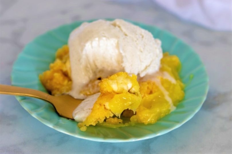 Serving of Lemon Cream Cheese Dump Cake: "A slice of Lemon Cream Cheese Dump Cake served on a plate, showcasing the tangy lemon filling and creamy texture."