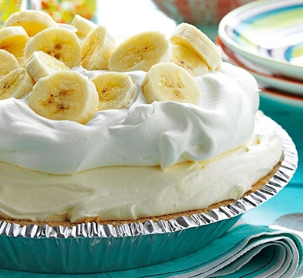 Ingredients 1 (6 oz) ready-to-use shortbread or graham cracker crumb crust 2 small boxes (3.4 oz each) banana cream instant pudding 2 cups half & half 1 bar (8 oz) cream cheese softened 1/3 cup granulated sugar 1 carton (8 oz) Cool Whip thawed sliced bananas & mini Nilla wafers for garnish Instructions In a mixing bowl, combine the dry pudding mix and half & half. Stir with a wire whisk for about 1-2 minutes or until the pudding mix is completely dissolved. Let it sit for a few minutes in the bowl so it can thicken up. Spread 1½ cups of the banana pudding into the bottom of the pie crust. Set aside the remaining half of pudding mix. In a mixing bowl, add the softened cream cheese and granulated sugar. Beat until combined and creamy. Add the Cool Whip and mix until combined. Add half of the Cool Whip mixture into the remaining half of banana pudding mix. Stir together. Spread this evenly over the 1st layer in the pie crust. Spread the remaining Cool Whip mixture on top of the pie for the 3rd layer. * If wanted, save the 3rd layer in the fridge and then you can pipe it on top of the pie before serving (as pictured in the post). Cover the pie with the enclosed plastic lid from the crust. Refrigerate for 8 hours or overnight.