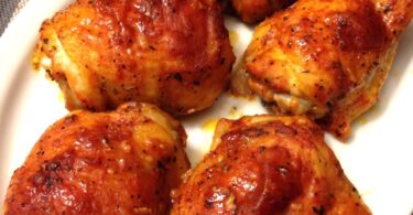 Image of baked chicken thighs on a plate