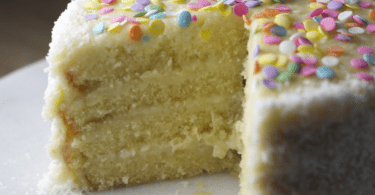 Creamy Coconut Cake with Shredded Coconut Topping