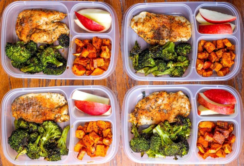 prepping vegetables and packing meals into food storage containers.