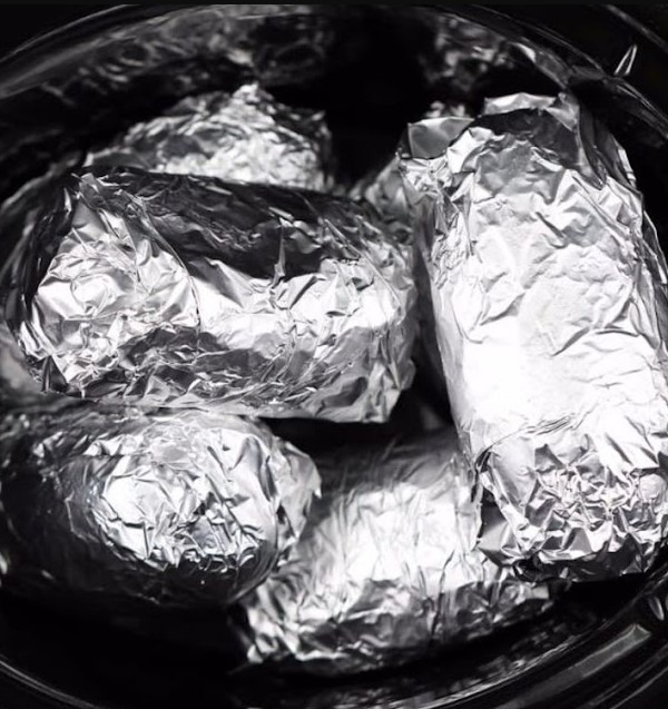 Savor the convenience of foil-wrapped Slow Cooker Baked Potatoes. Explore an effortless recipe that delivers tender spuds with a perfect hint of slow-cooked flavor.