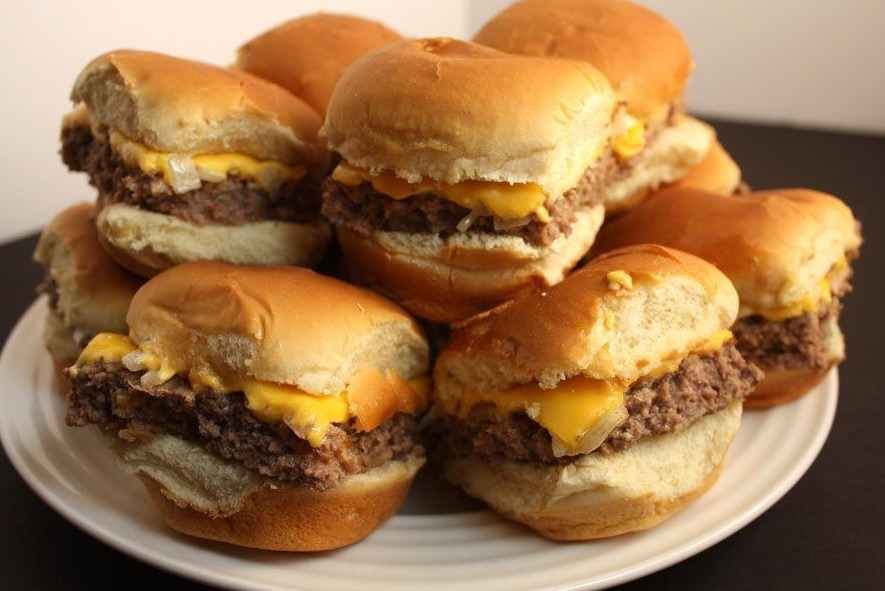 Grilled cheeseburger sliders with melted cheese