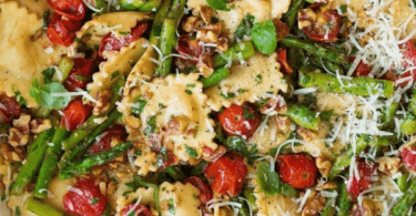 Ravioli with Asparagus & Tomato served in a bowl